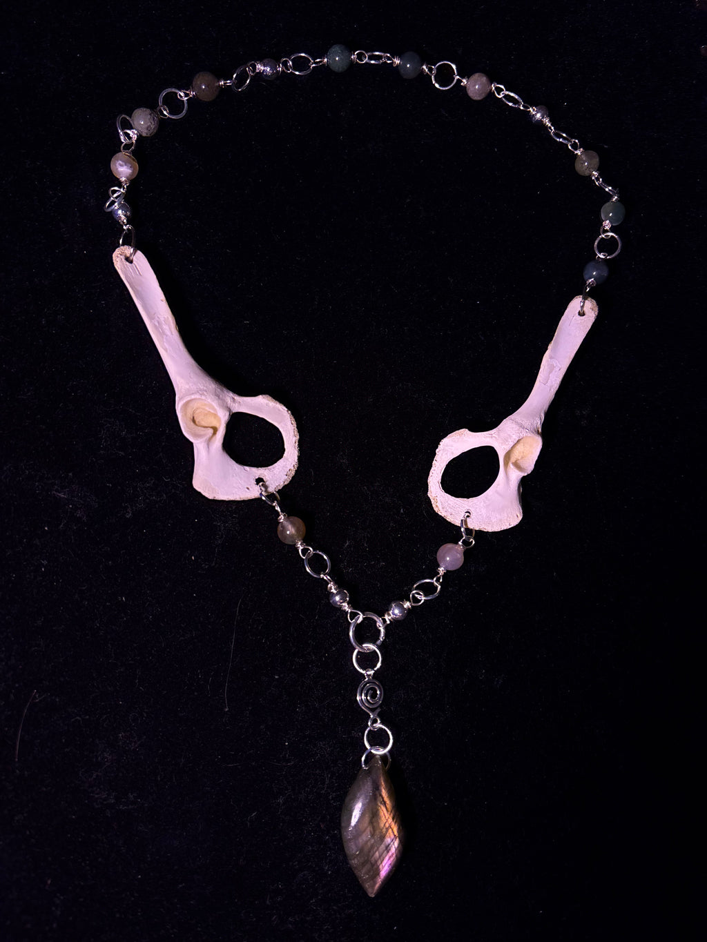 Racoon pelvis and labradorite necklace
