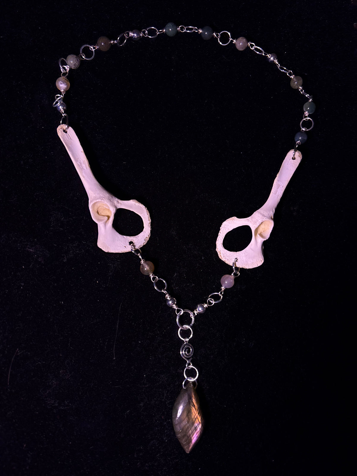 Racoon pelvis and labradorite necklace