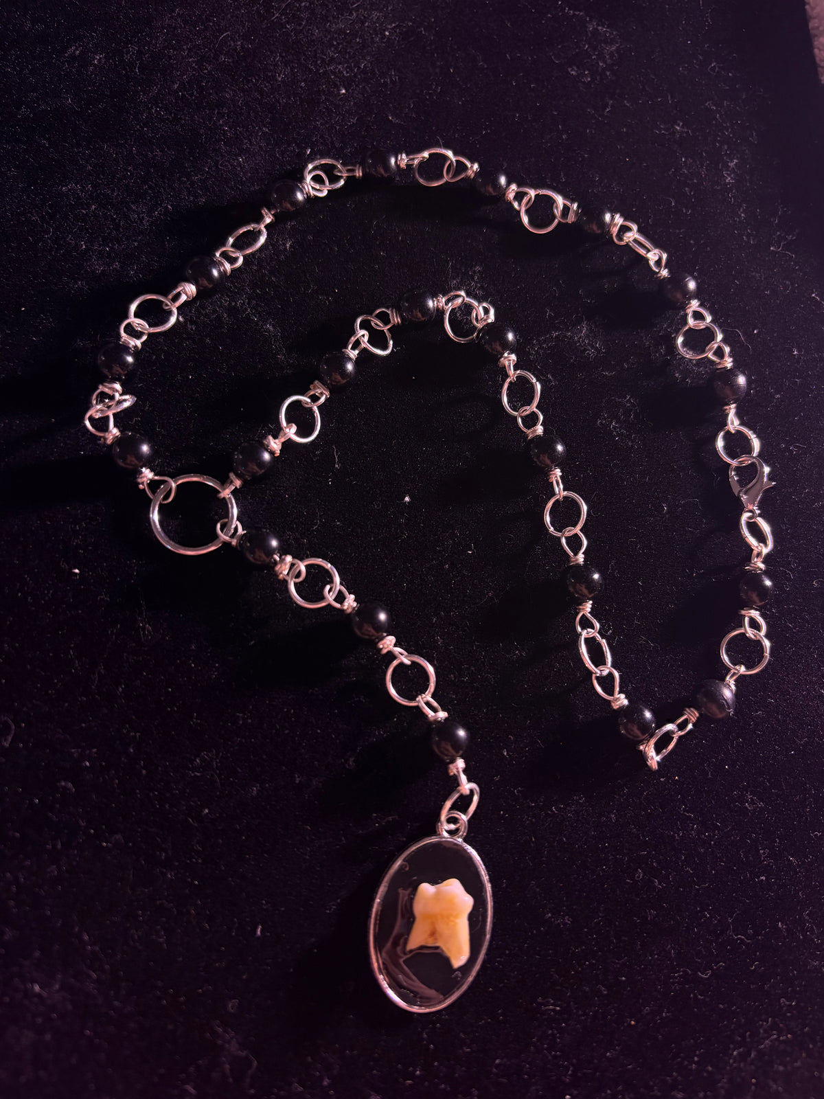 Human tooth rosary