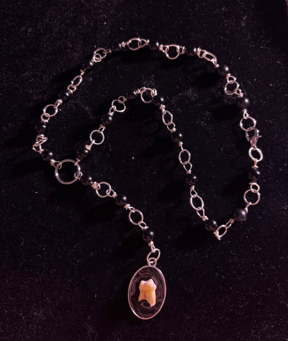Human tooth rosary